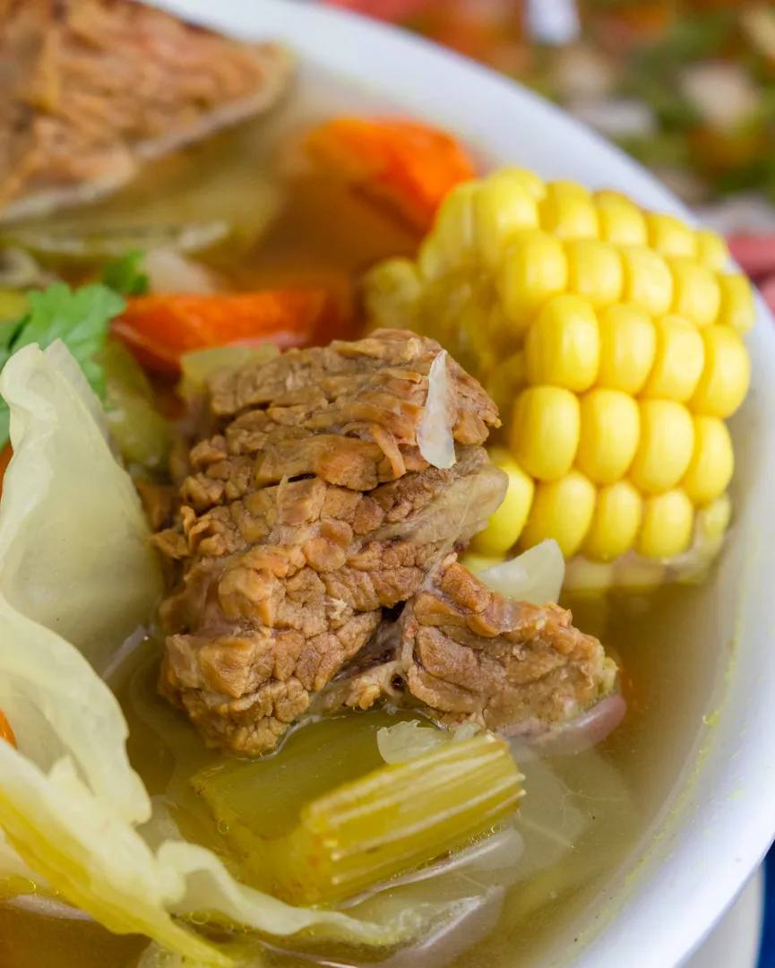 Caldo de res with beef, corn on the cob and vegetables